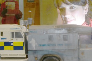   Emma Wilson takes a closer look at model of a riot damaged RUC Tangi Landrover . Photo: Picture Martin McKeown. Inpresspics.com.