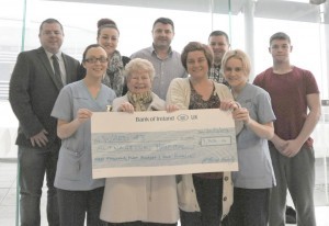 Members of the McBride family presenting Ward 43 Staff Nurses Noeleen Reynolds and Jackie  Gallagher with the proceeds from their father's tribute night.