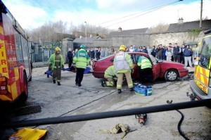 Emergency services staging a crash rescue simulation to young people from the Brandywell,