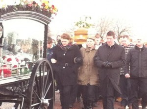 Colette Quigley ahead of Andrew's remains as they make their way to the City Cemetery.