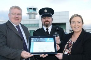 Inspector Declan McGrath presenting the Park Mark safer parking award to Damien Tierney and Charlene Shongo, airport director and commercial manager.