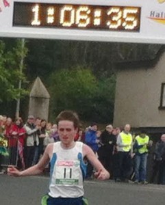 Eamon McGinley crossing the finish line to win the Omagh Half Marathon.