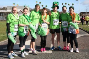 Members of REACH who warmed up for today's parade by competing in yesterday's St Patrick's 5k at Gransha.