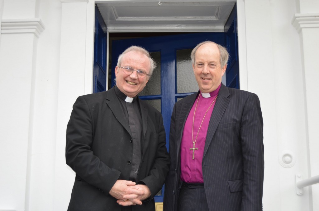 Bishop McKeown (left) is welcomed to the Church of Ireland See House by Bishop Ken Good.
