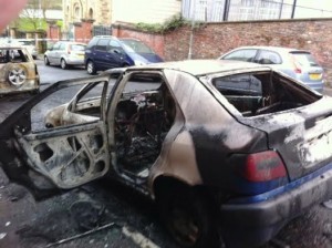 One of the cars destroy in the arson attack.