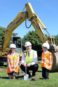 Education Minister John O'Dowd with Eglinton Primary School  pupils Laura McClelland and Rhys Thompson, at the sod cutting ceremony to start the building of the new school. Photo: Lorcan Doherty Photography