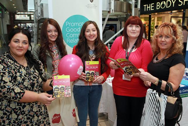 Members of the public Ann McElchar and her daughters Nanette and Michelle, with Derry City Council’s Community Relations officers Helena Kearney (second from right) and Michaela Devine (left), by their stand in the Foyleside Shopping Centre, promoting Community Relations Week (Photo: Maurice Thompson)