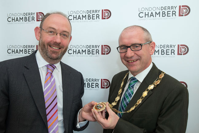 New president of Derry Chamber of Commerce, Gerry Kindlon (right), receiving the chain of office from his predecessor, Gerry Gilliland. Photo: Martin McKeown. Inpresspics.com.