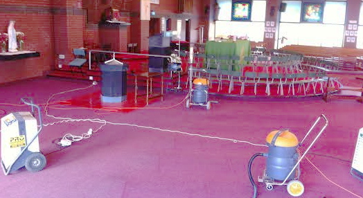 Holy Family Church being "dried out" after being flooded.