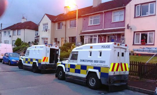 Police landrovers outside the Bradley home in Creggan.