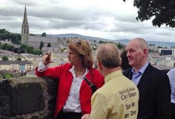 Tanaiste Rose Bruton on Derry's Walls with Foyle MP Mark Durka and tour guide Martin McCrossan,