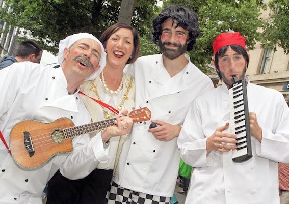 The Mayor Brenda Stevenson, is serenaded by the "Singing Chefs" at the Foyle Seafood Festival in Guildhall Square.    