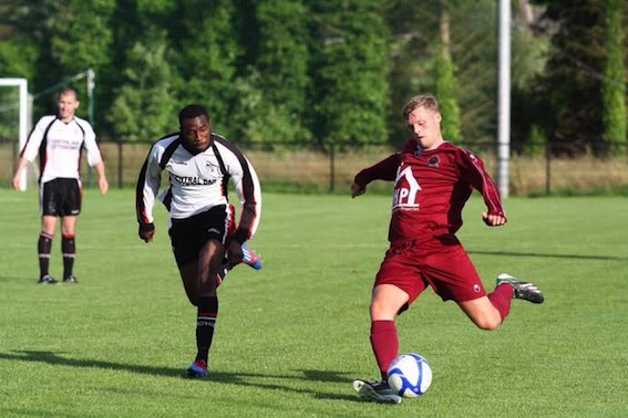 Institute’s Lee Toland puts in a cross depsite the attention of Letterkenny’s Steve Okapu.