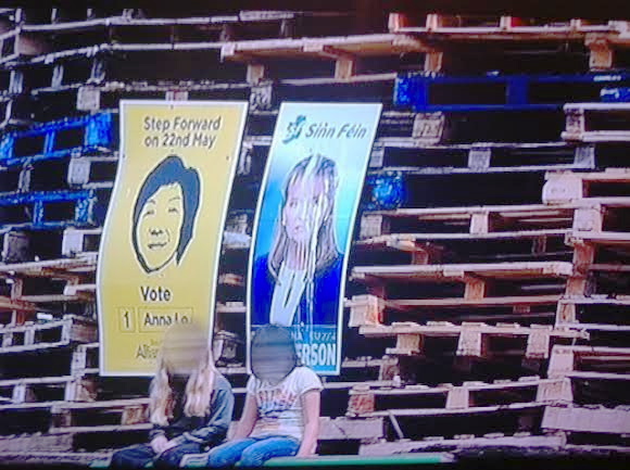 Martina Anderson and Anna Lo's European Election posters on the Bangor bonfire.