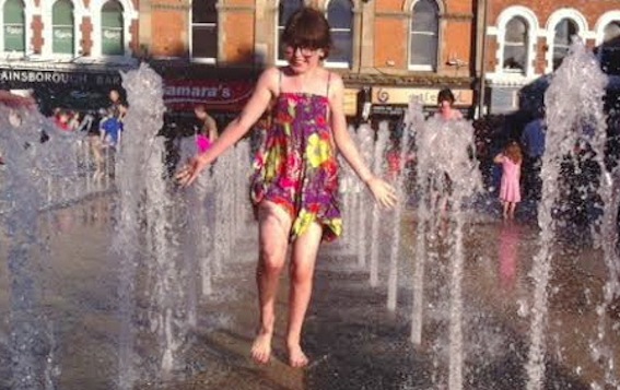 Young Orla Cooper cooling down amid the fountains in Guildhall Square yesterday.