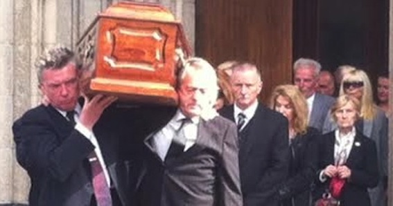 Michael Bradley (left) and Sean Coyle carry the remains of Gerry Anderson from St Eugene's Cathedral.