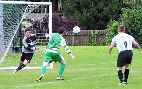 Tony's Bhoys keeper Patrick Quigley closes down a Top of the Hill chance in their quarter-final clash.