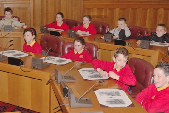 Children from the Model and Steelstown Primary Schools in the chamber of the Guildhall during last year's Local Democracy Week.