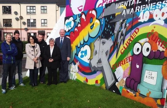 Foyle MP Mark Durkan with members of the Beacon Centre at Free Derry Corner to support World Mental Health Day.