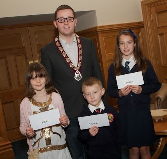 Deputy Mayor Gary Middleton with winners of the Local Democracy "art competition for schoolchildren". From left, are Eisa Morgan (Model PS), Travis Brown (Holy Child PS), and Lauren Burton (Rosemount PS). (Photo - Tom Heaney, nwpresspics)