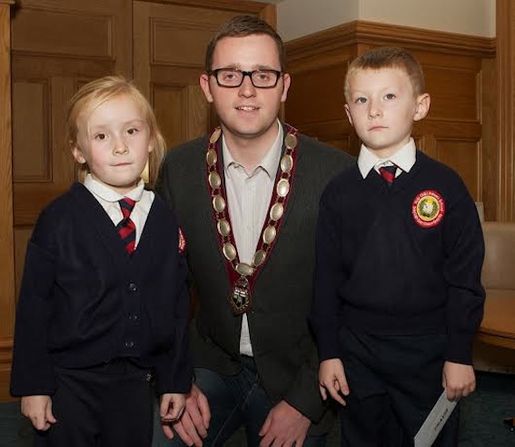 Deputy Mayor Gary Middleton with Local Democracy Week art competition winner Travis Brown (Holy Child PS). Included is twin sister Summer. (Photo - Tom Heaney, nwpresspics)