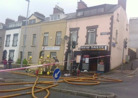 Firefighters at the scene of the fire at the New Taste Chinese takeaway.
