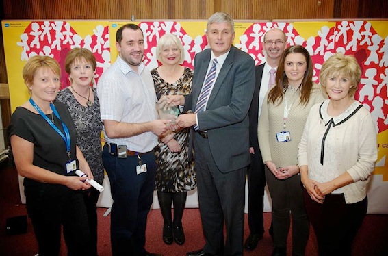 The maternity team at Altnagelvin Hospital receiving their Quality and Safety Award from Health Minister Jim Wells. Included are Gerry Guckian, Trust chairman and Elaine Way, chief executive.