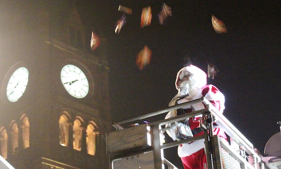 Santa distributing sweets to the crowd in Guildhall Square.