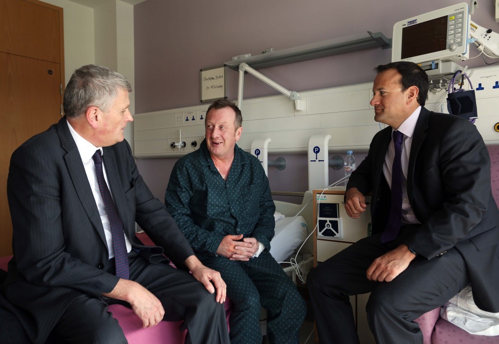 Health Minister Jim Wells, along with the Irish Health Minister, Leo Varadkar,chatting to patient Christopher Dickie, from Articlave, during a visit to the new Cath Labs  to view the new cardiology service and then visited the site of the hospital’s new Radiotherapy Unit.