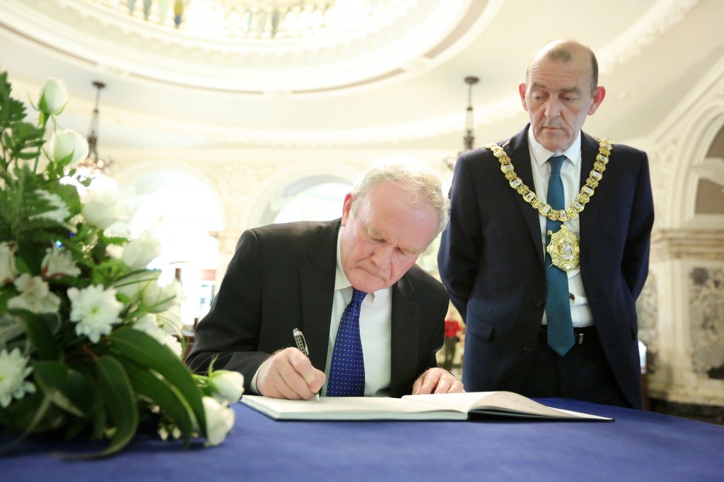 The deputy First Minister Martin McGuinness today visited Belfast City Hall to sign the book of condolence which opened today for the 38 people who died in the attack at a Tunisian beach resort last Friday. Pictured with the deputy First Minister is Lord Mayor Arder Carson. Picture by Kelvin Boyes / Press Eye.