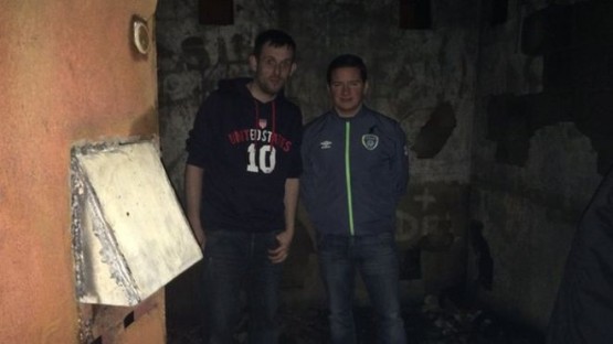 Sinn Fein councillor Colly Kelly with on of the residents at the fire in Garton Square last month
