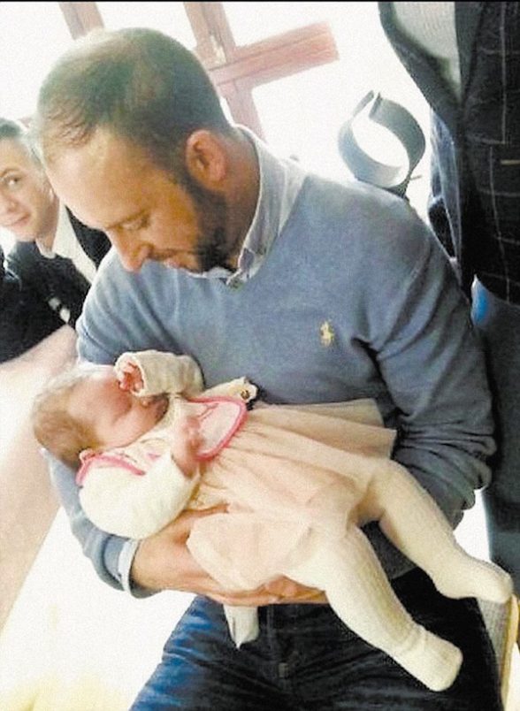 Davitt meets the baby just days after he saved her life in March this year Pic Joe Boland/NorthWest NewsPix
