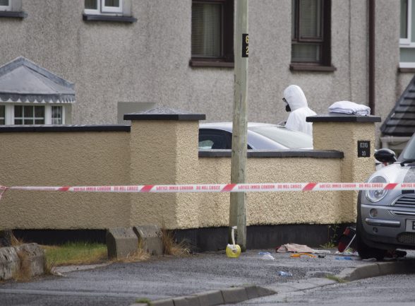 Forensic officers entering the scene of the fatal stabbing in Derry. (North West Newspix)