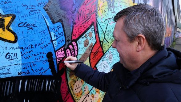 Never Been North on TV3 - Ed Finn signing the peace walls in Derry