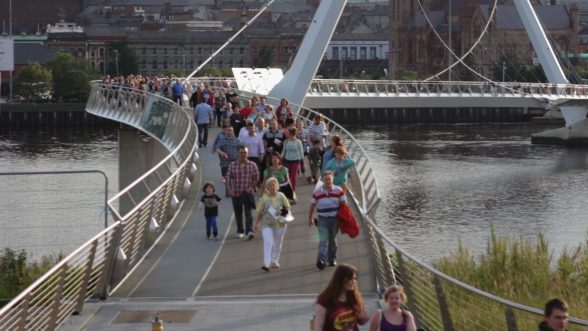 Never Been North on TV3- People walking across the peace bridge in Derry