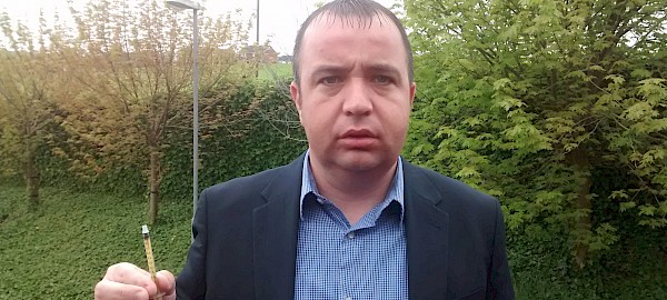 SDLP councillor Brian Tierney with the syringe found by a four-year-old child in the Bloomfield Park area