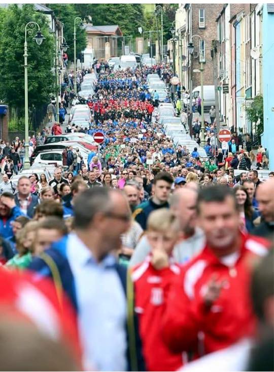 Footballers, teams and fans parading through Derry last year