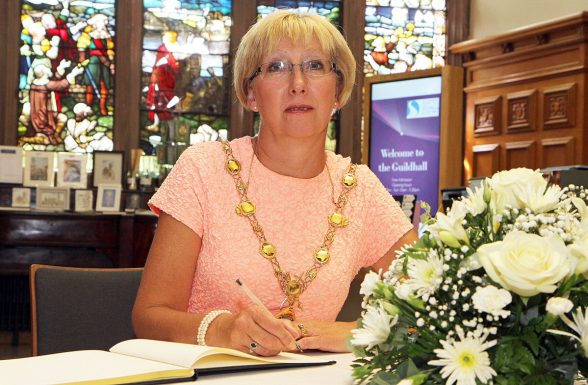 Mayor of Derry Alderman Hilary McClintock signing the book of condolence for the dead and injury in Nice truck terror attack last week