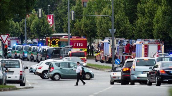 Police and firefighters are seen near a shopping mall amid a shooting on July 22, 2016 in Munich. Several people were killed on Friday in a shooting rampage by a lone gunman in a Munich shopping centre