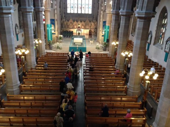 The public file in to St Eugene's Cathedral to pay their respects to Bishop Daly whose remains are in repose