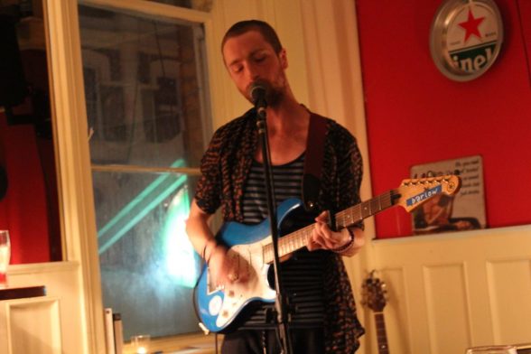 Singer and musician Stephen Martin with his blue Fender which was stolen by thieves from his Derry flat