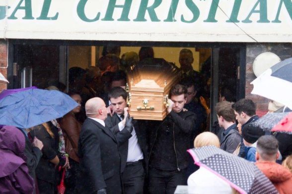 Mourners carry the coffin of Stephen 'Stevie' Martin aka 'Rainy Boy Sleep' from the Derry/Donegal Christian Fellowship in Derry following a service
