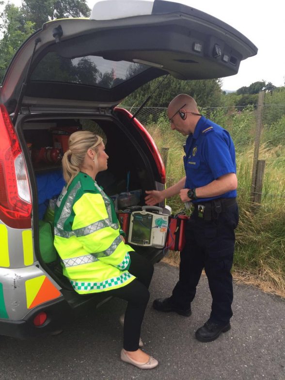 Health Minister Michelle O'Neill talking to a first responder paramedic