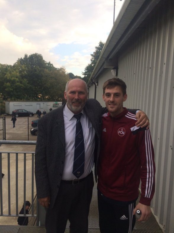 Institute FC chairman Bill Anderson welcomes back player Niall Grace to the club on Saturday
