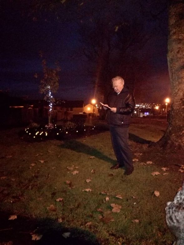 Fr Paddy O'Kane leading those gathered last night at the garden of remembrance in prayer for their loved ones