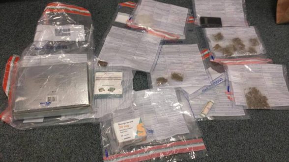 Police put on display drugs, cash and drug dealing paraphernalia seized in Derry last night