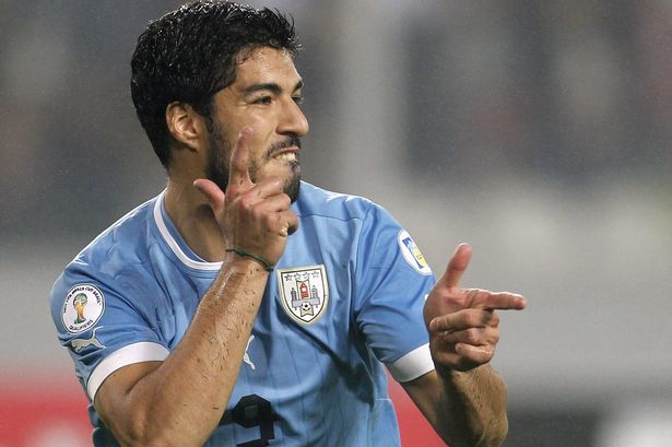 Uruguays-Suarez-celebrates-after-scoring-against-Peru-during-their-2014-World-Cup-qualifying-soccer-match-in-Lima-2258257