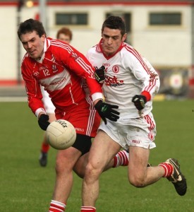 Derry's Mark Lynch and Tyrone's Damian McCaul