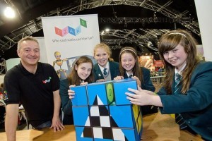 Franz Schlindwein,managing director and founder, with local schoolchildren enjoying the Qubizm stand during CultureTECH 2013 at Ebrington,