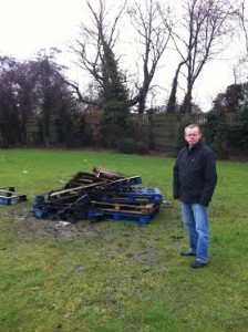 Cllr McGinley at the remains of one of the fires.